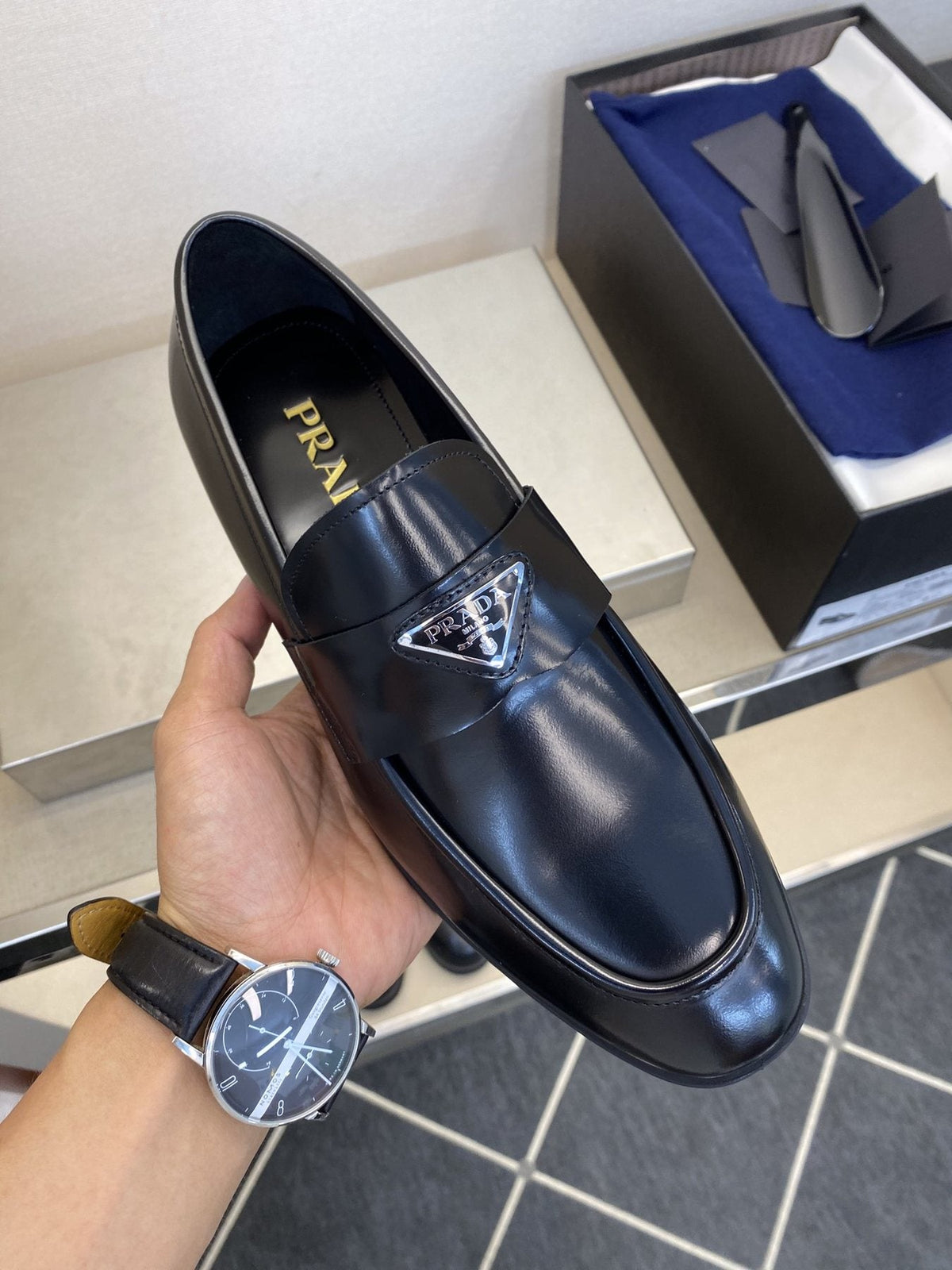 Prada Black Triangle Plaque Loafers — model