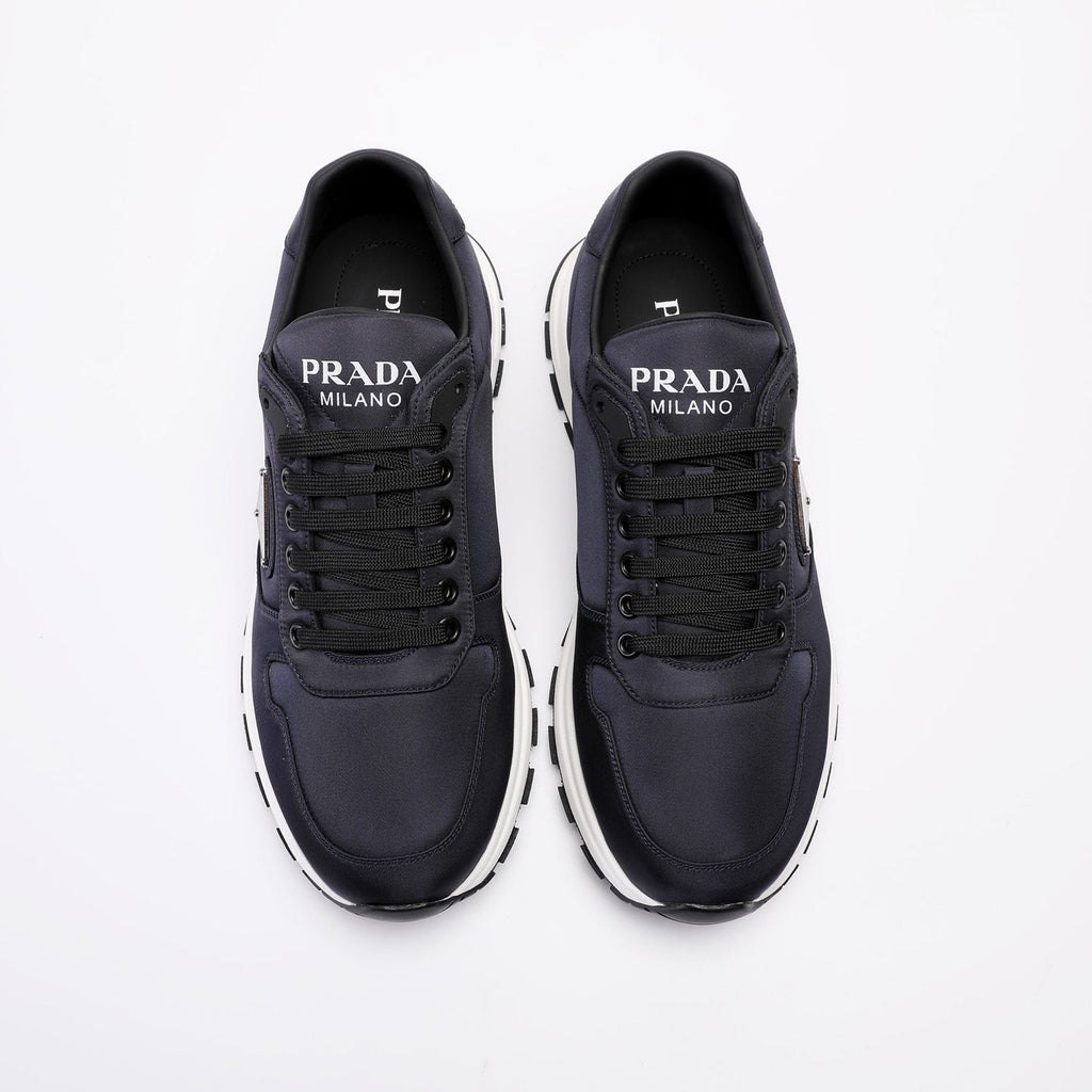 PRADA Navy Triangle Badge Sneakers — hero