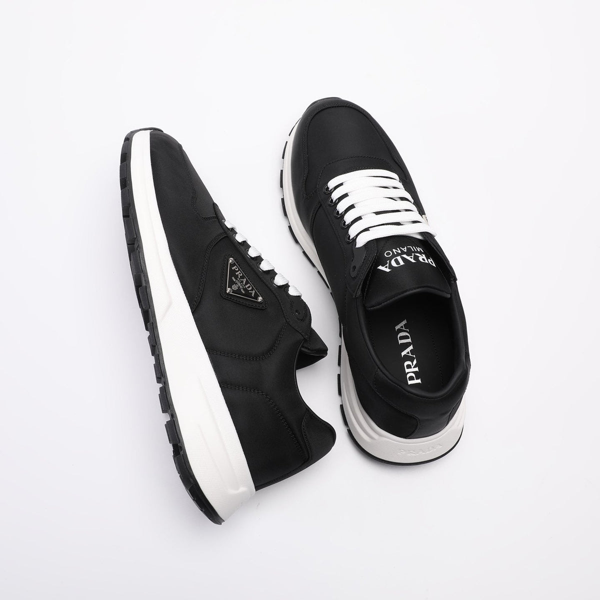 PRADA Navy Triangle Badge Sneakers — front