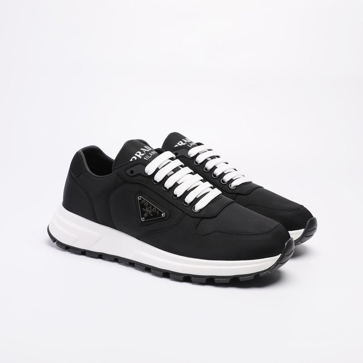 PRADA Navy Triangle Badge Sneakers — front