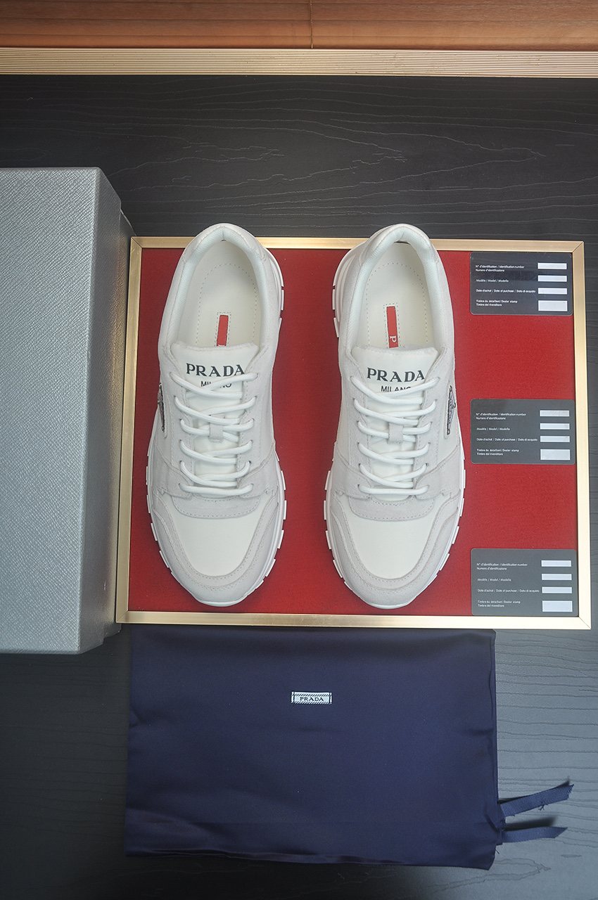 Prada Triangle Plaque Low-Top Sneakers — front