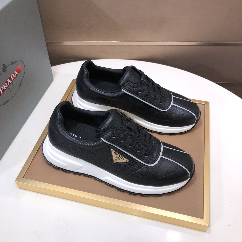 Prada Triangle Plaque Low-Top Sneakers — front